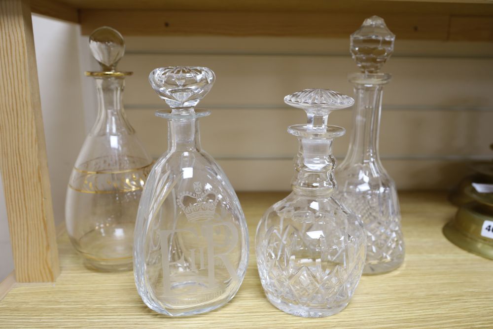 A silver Jubilee 1977 commemorative etched decanter and stopper and three other glass decanters, tallest 29cm